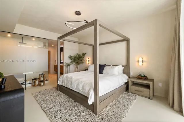 a bedroom with a bed and a table