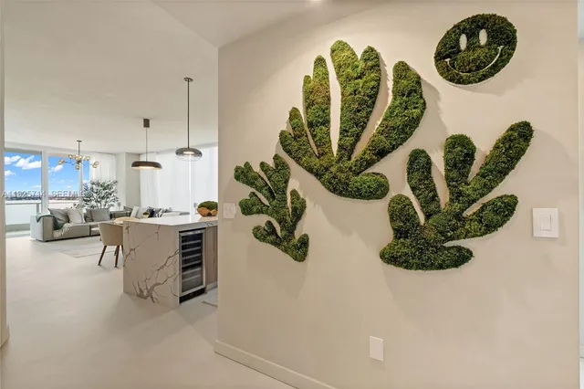 a view of living room with furniture and a chandelier