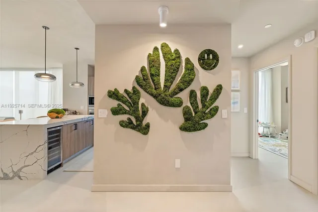 a view of kitchen with cabinets and window