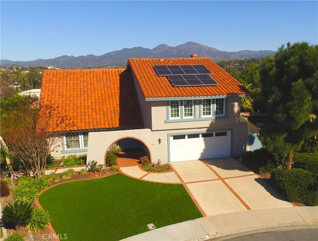 an aerial view of a house with a garden