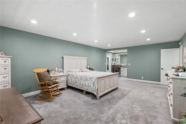 a bedroom with a bed and furniture