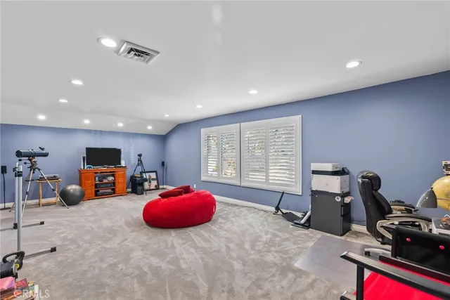 a room with furniture and a flat screen tv