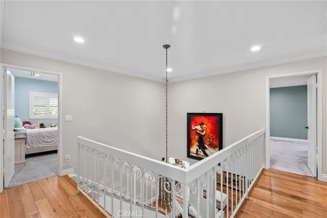 a view of a hallway with paintings on the wall