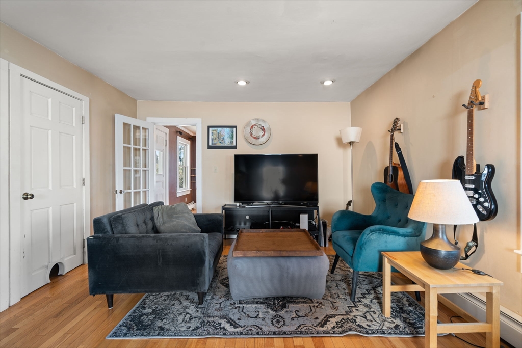 2 Brooks Street Maynard, MA 01754 - Photo 12 of 42 a living room with furniture and a flat screen tv