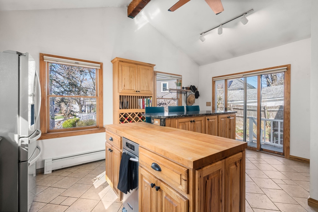 2 Brooks Street Maynard, MA 01754 - Photo 18 of 42 a living room with stainless steel appliances furniture a large window and a kitchen view