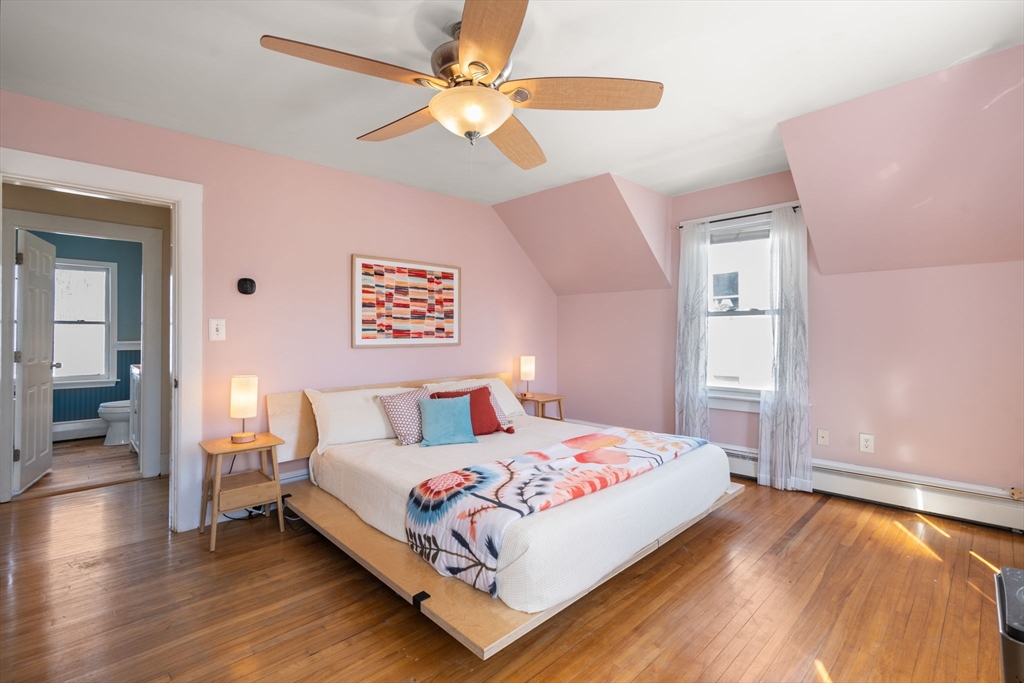 2 Brooks Street Maynard, MA 01754 - Photo 27 of 42 a bedroom with a bed and a ceiling fan
