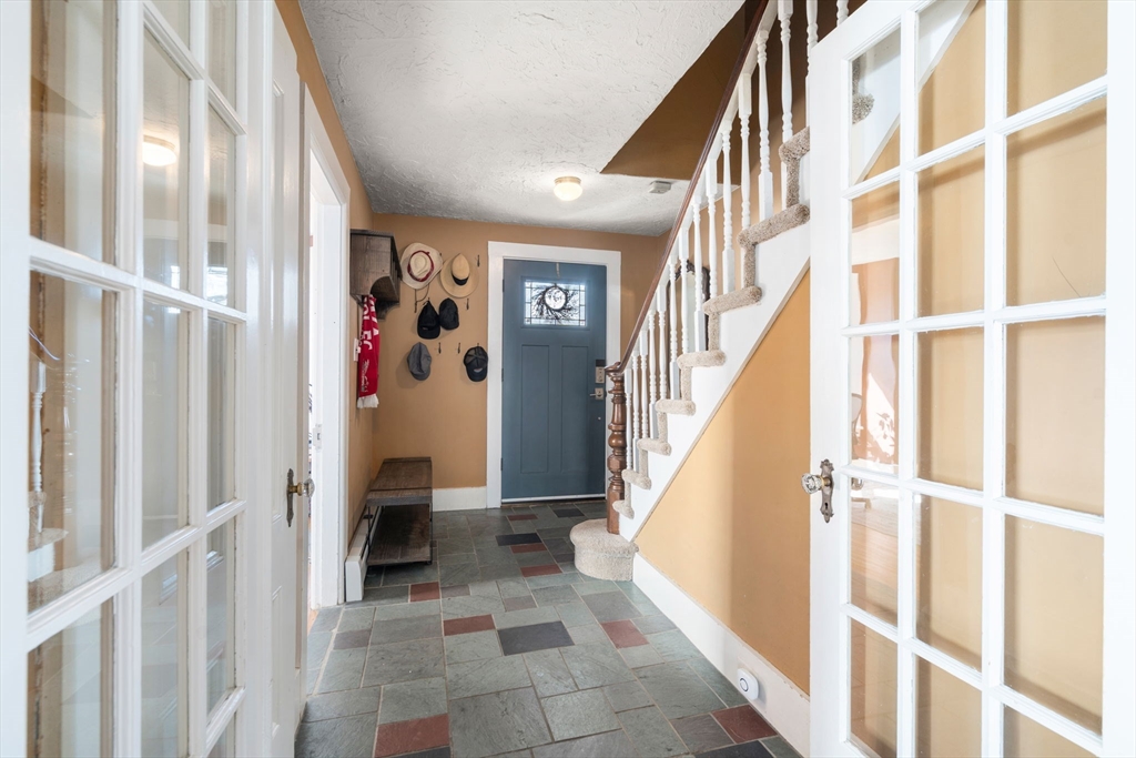 2 Brooks Street Maynard, MA 01754 - Photo 7 of 42 a view of entryway with stairs and furniture