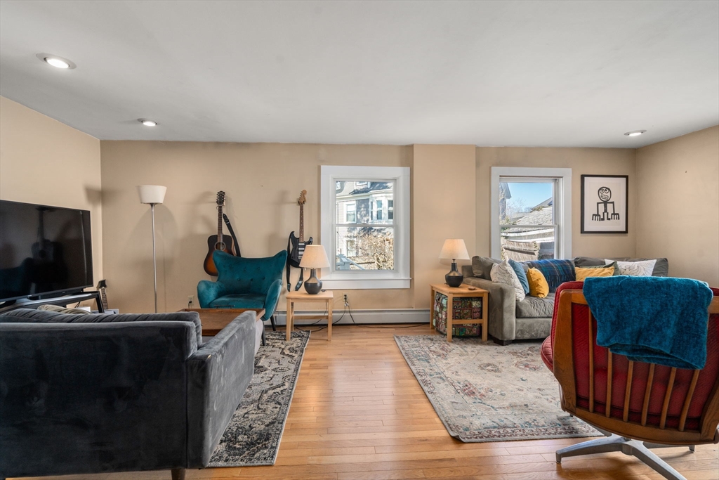 2 Brooks Street Maynard, MA 01754 - Photo 8 of 42 a living room with furniture a window and a flat screen tv