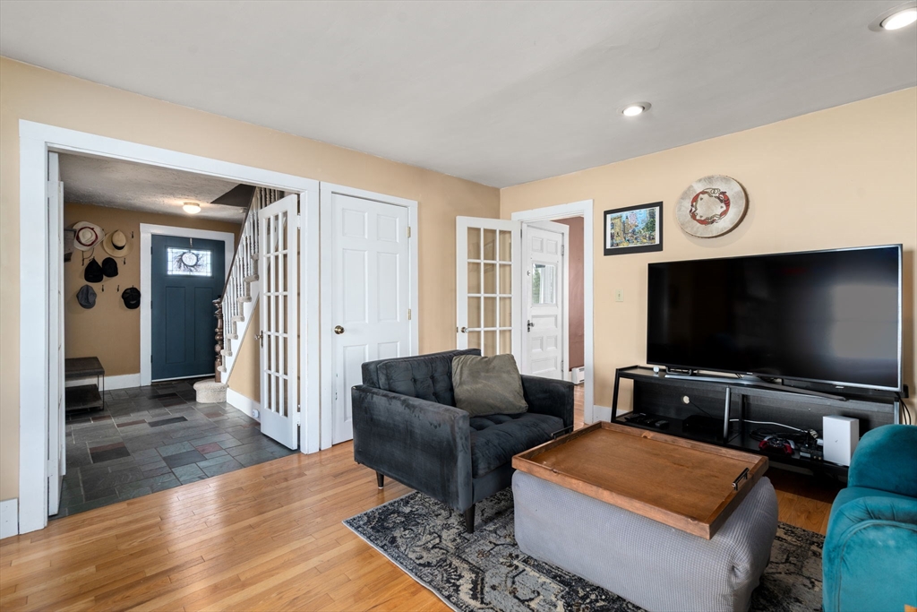 2 Brooks Street Maynard, MA 01754 - Photo 10 of 42 a living room with furniture and a flat screen tv