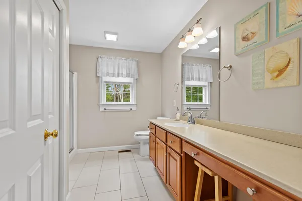 a bathroom with a sink a vanity and a mirror