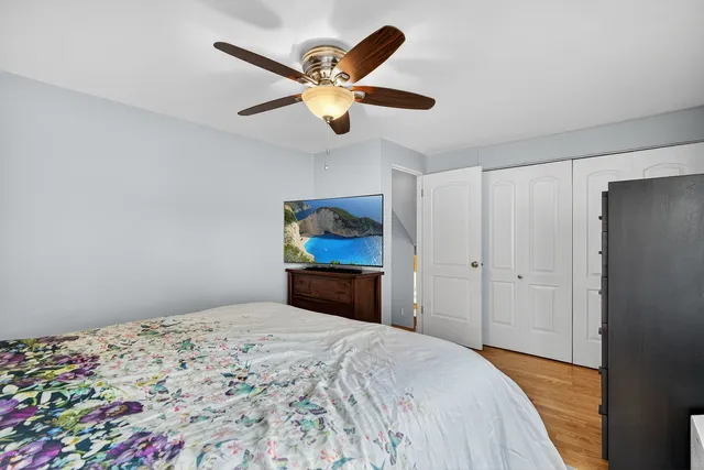 a bedroom with a bed and a dresser