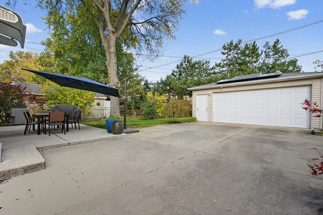 a view of an outdoor sitting area with furniture and backyard