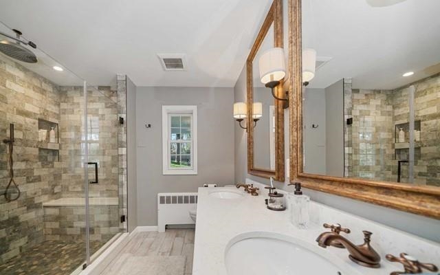 453 West Saddle River Road Upper Saddle River, NJ 07458 - Photo 13 of 28 a bathroom with a double vanity sink mirror and shower