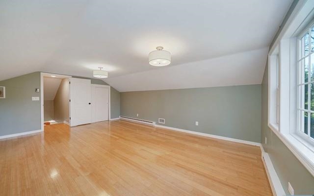 453 West Saddle River Road Upper Saddle River, NJ 07458 - Photo 18 of 28 a view of an empty room with wooden floor and a window