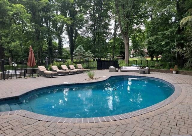 453 West Saddle River Road Upper Saddle River, NJ 07458 - Photo 23 of 28 a view of a swimming pool with a sitting space