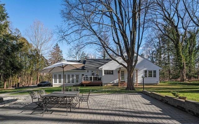 453 West Saddle River Road Upper Saddle River, NJ 07458 - Photo 24 of 28 a front view of a house with a yard