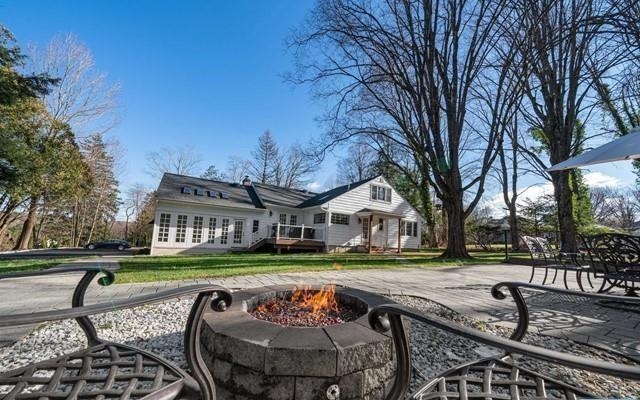 453 West Saddle River Road Upper Saddle River, NJ 07458 - Photo 25 of 28 a front view of a house with garden and trees