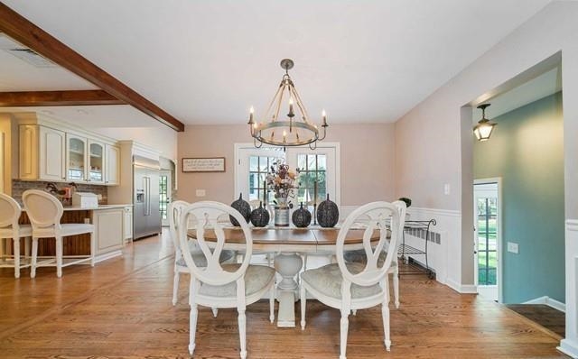 453 West Saddle River Road Upper Saddle River, NJ 07458 - Photo 6 of 28 a view of a dining room with furniture wooden floor and chandelier
