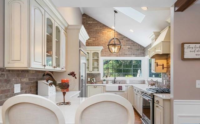 453 West Saddle River Road Upper Saddle River, NJ 07458 - Photo 10 of 28 a kitchen with a stove a sink and a microwave