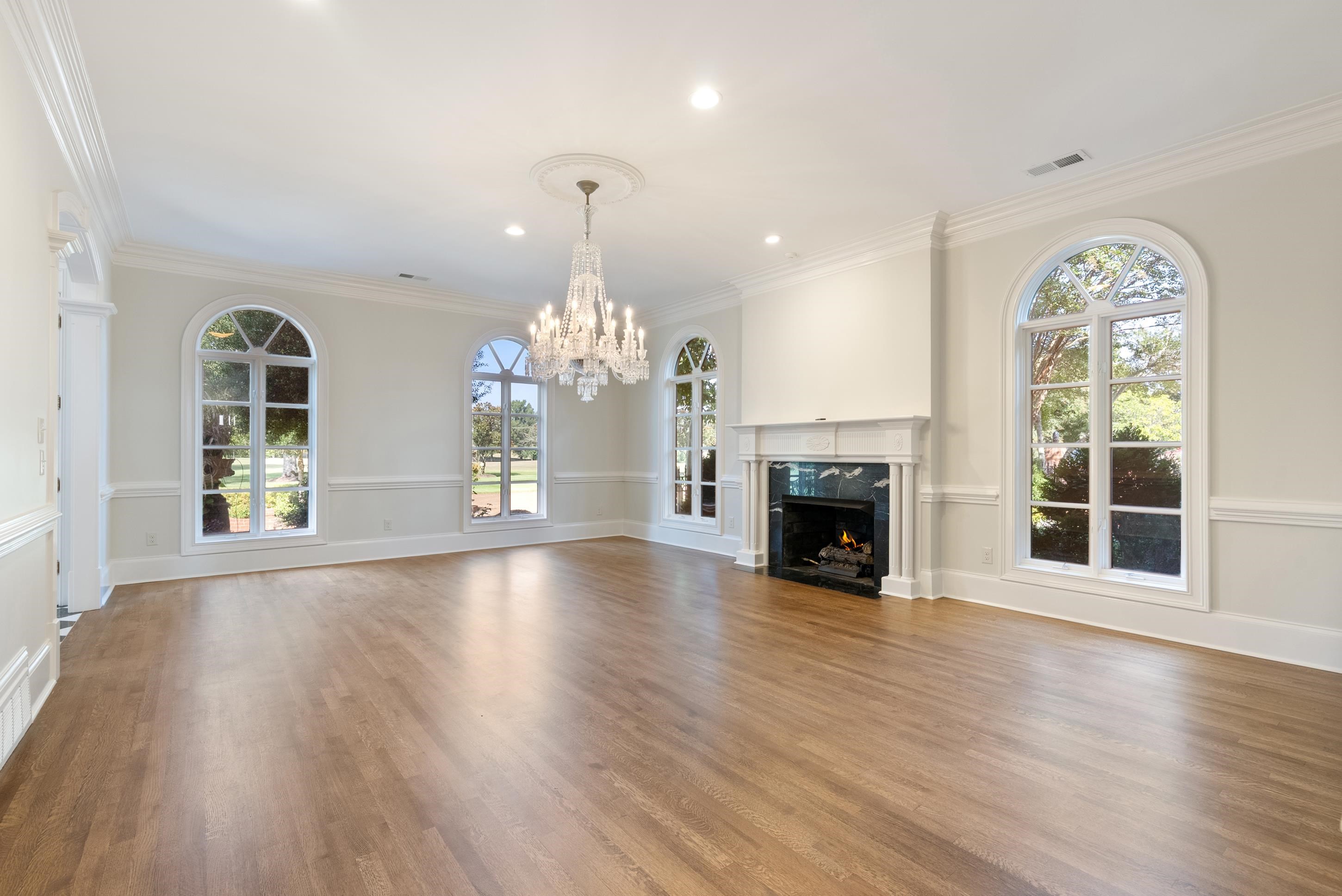 1800 North Collierville Arlington Road Eads, TN 38028 - Photo 11 of 40 a view of an empty room with wooden floor fireplace and a window