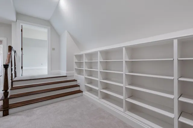 a view of an chairs under an umbrella