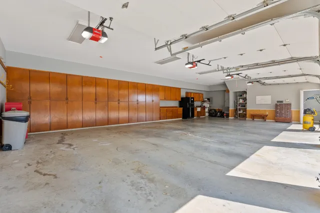 a kitchen with a table and chairs in it