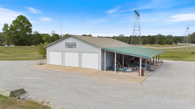 an aerial view of a house with garden space and lake view