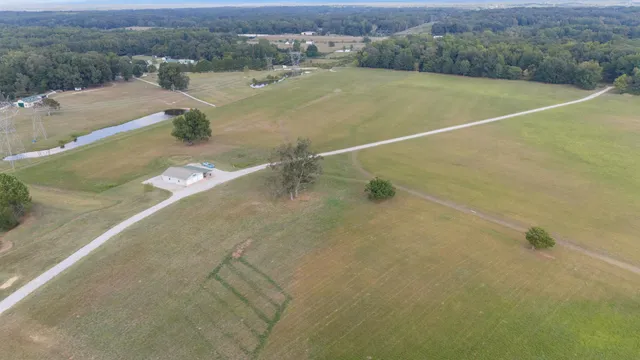 a view of a hallway with a black white checkered floor and stairs
