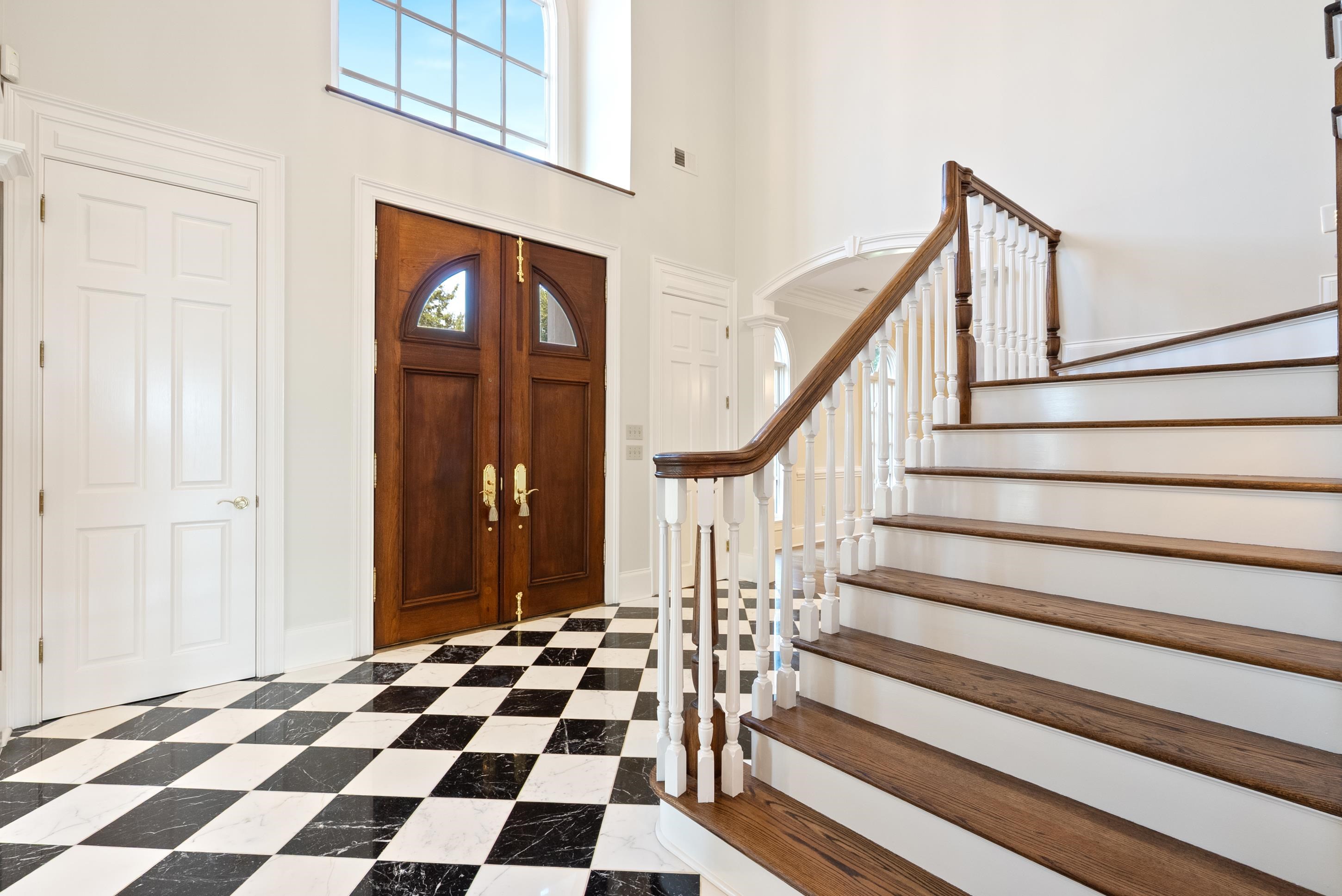 1800 North Collierville Arlington Road Eads, TN 38028 - Photo 6 of 40 a view of a hallway with a black white checkered floor and stairs