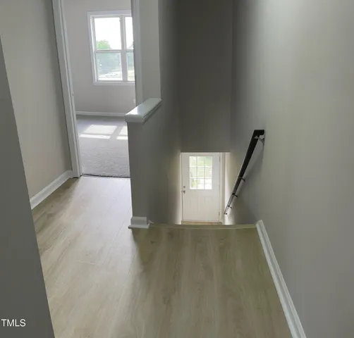 a view of an empty room and window