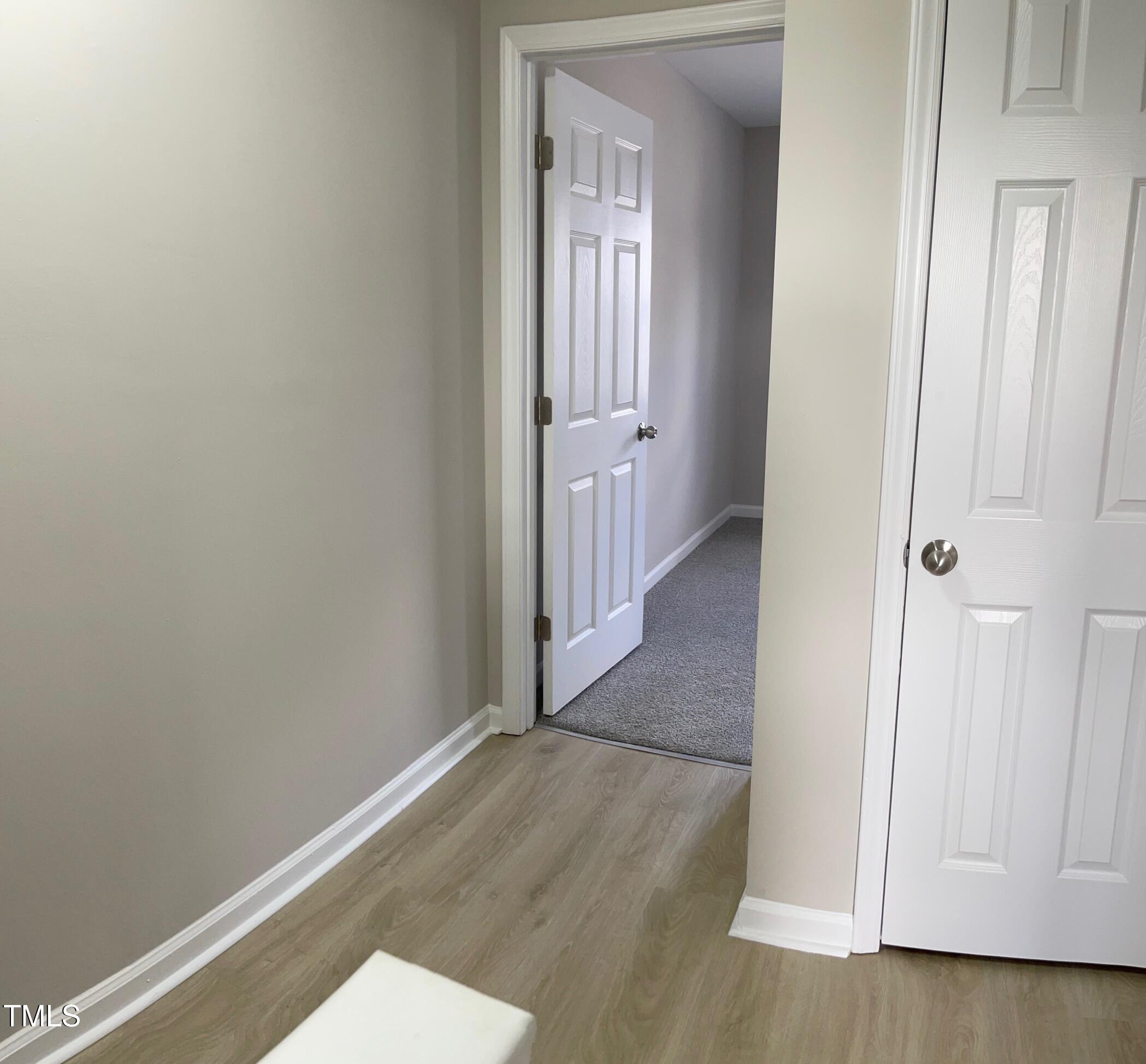 351 East Williams Street Angier, NC 27501 - Photo 19 of 24 a view of a hallway with wooden floor