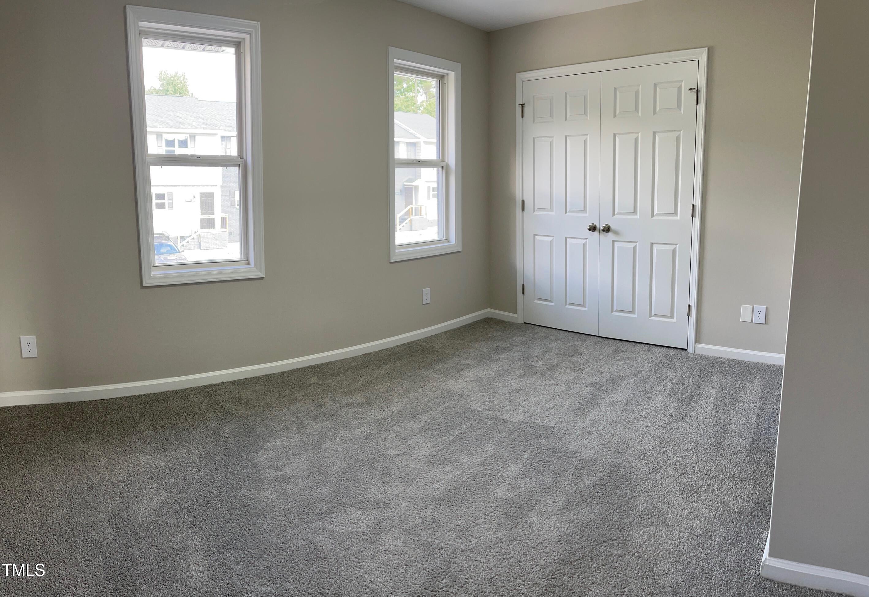 351 East Williams Street Angier, NC 27501 - Photo 20 of 24 an empty room with windows