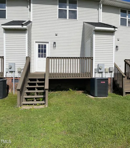 a view of a backyard with a deck