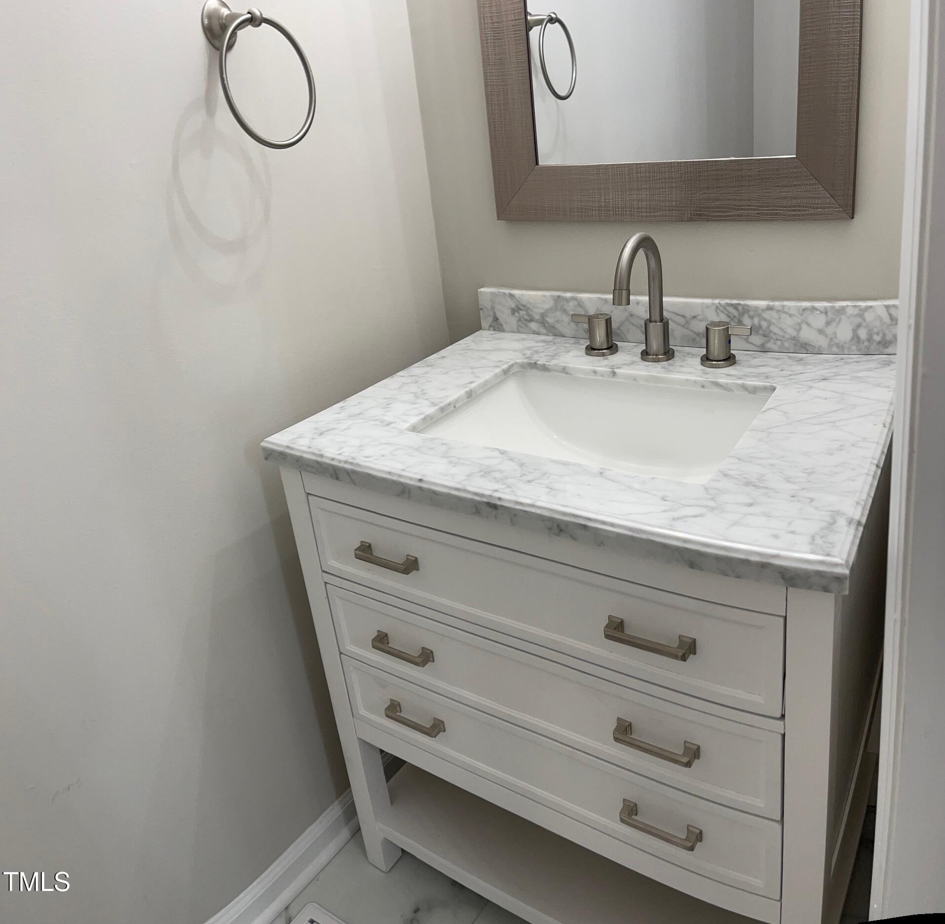 351 East Williams Street Angier, NC 27501 - Photo 24 of 24 a bathroom with a granite countertop sink and a mirror