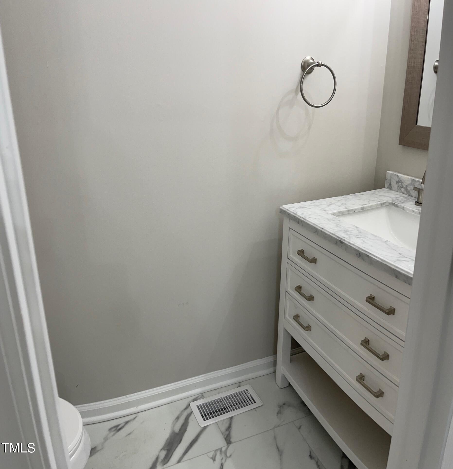 351 East Williams Street Angier, NC 27501 - Photo 9 of 24 a bathroom with a granite countertop sink and a mirror