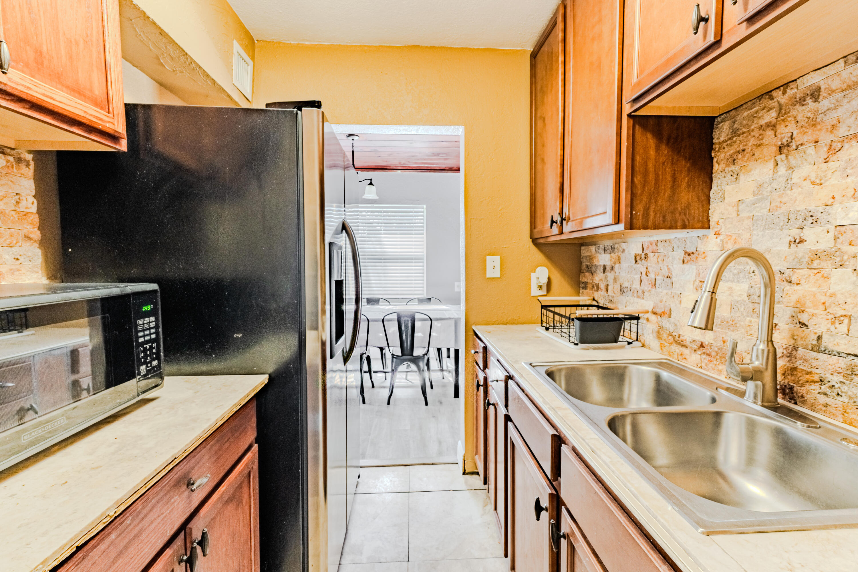 112 West 34th Street, Unit 1 Riviera Beach, FL 33404 - Photo 19 of 23 a kitchen that has a sink and a stove