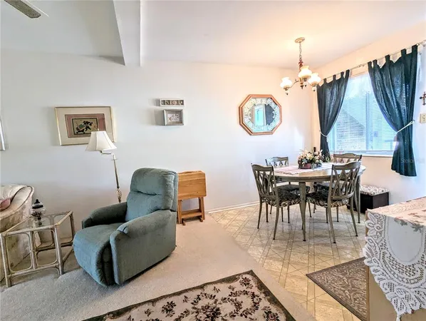 a living room with furniture and a lamp