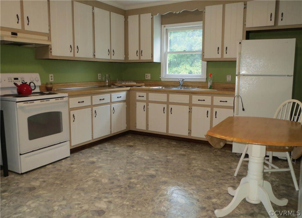 833 Old Ridge Road Farmville, VA 23901 - Photo 4 of 14 a kitchen with granite countertop a sink cabinets stainless steel appliances and a window