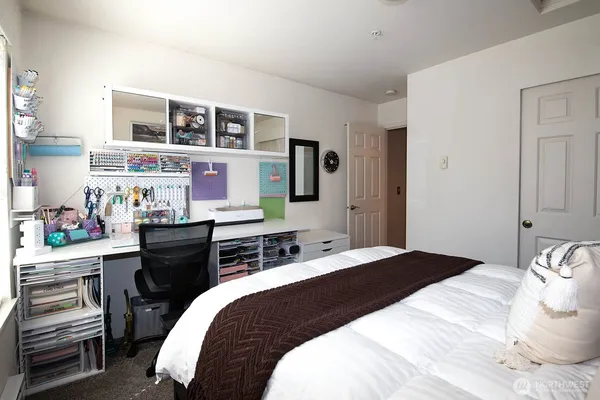 a bedroom with a bed and a closet