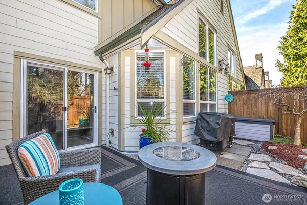 a view of a two chairs in the patio
