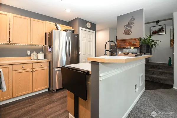 a kitchen with a sink stove and refrigerator