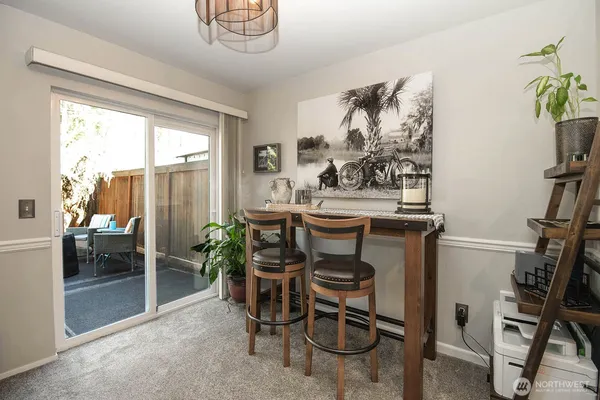 a view of a dining room with furniture window and outside view