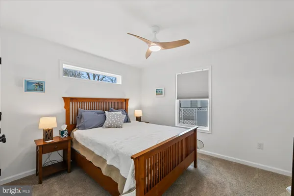 a bed room with a bed and a night stand