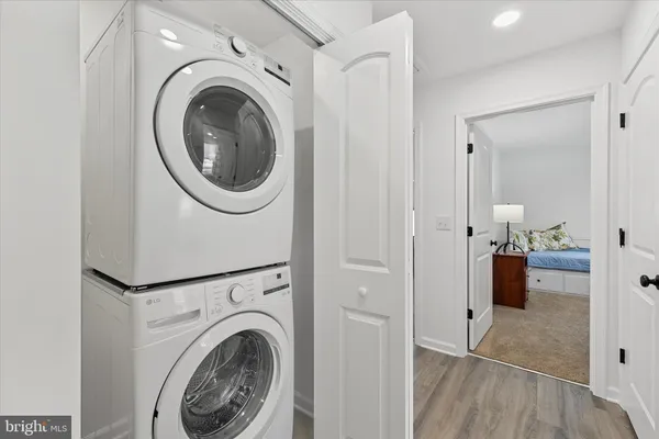 a view of a hallway with washer and dryer