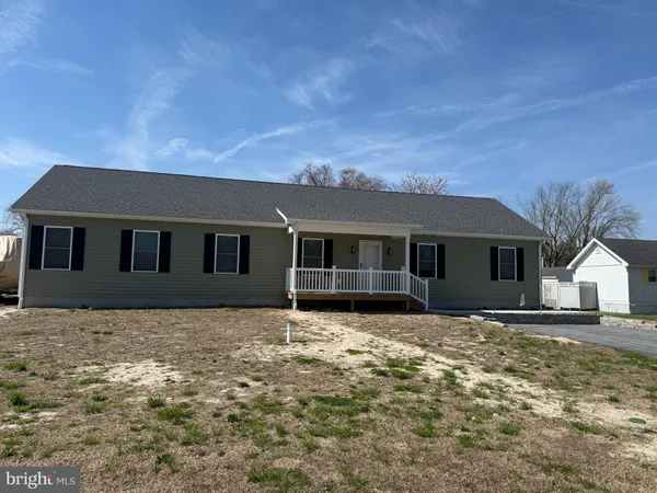 a house that has a big yard in front of it