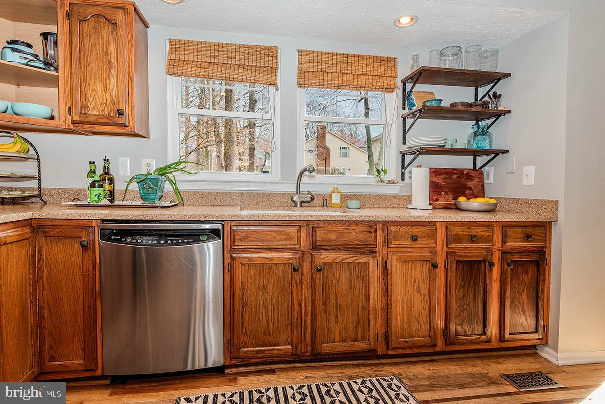 1665 Patrice Circle Crofton, MD 21114 - Photo 13 of 55 a kitchen with stainless steel appliances a sink and cabinets