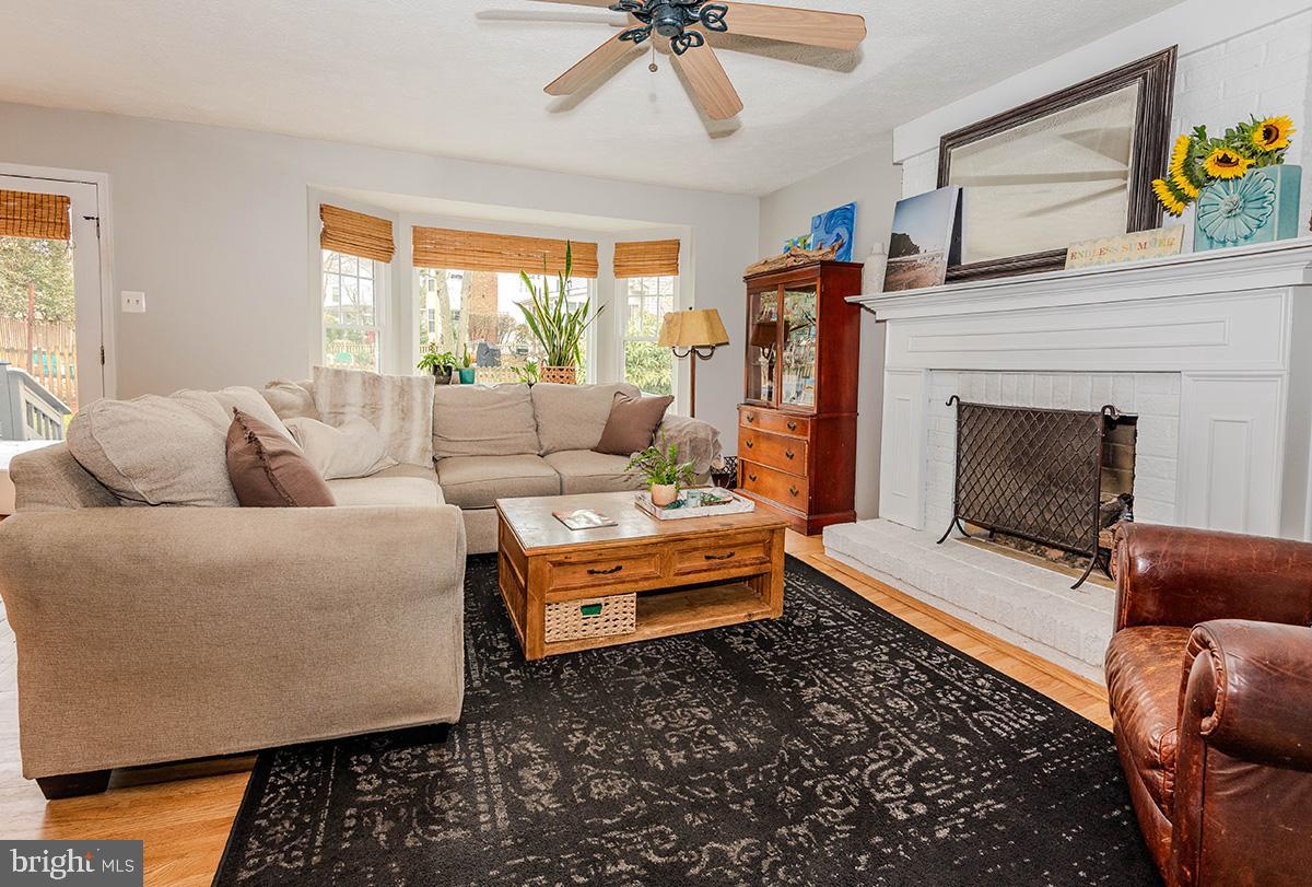 1665 Patrice Circle Crofton, MD 21114 - Photo 16 of 55 a living room with furniture and a fireplace