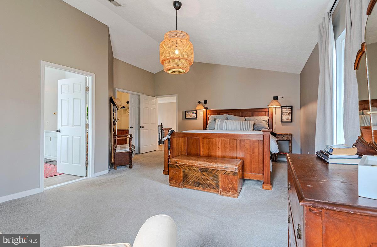 1665 Patrice Circle Crofton, MD 21114 - Photo 21 of 55 a bedroom with furniture and a chandelier