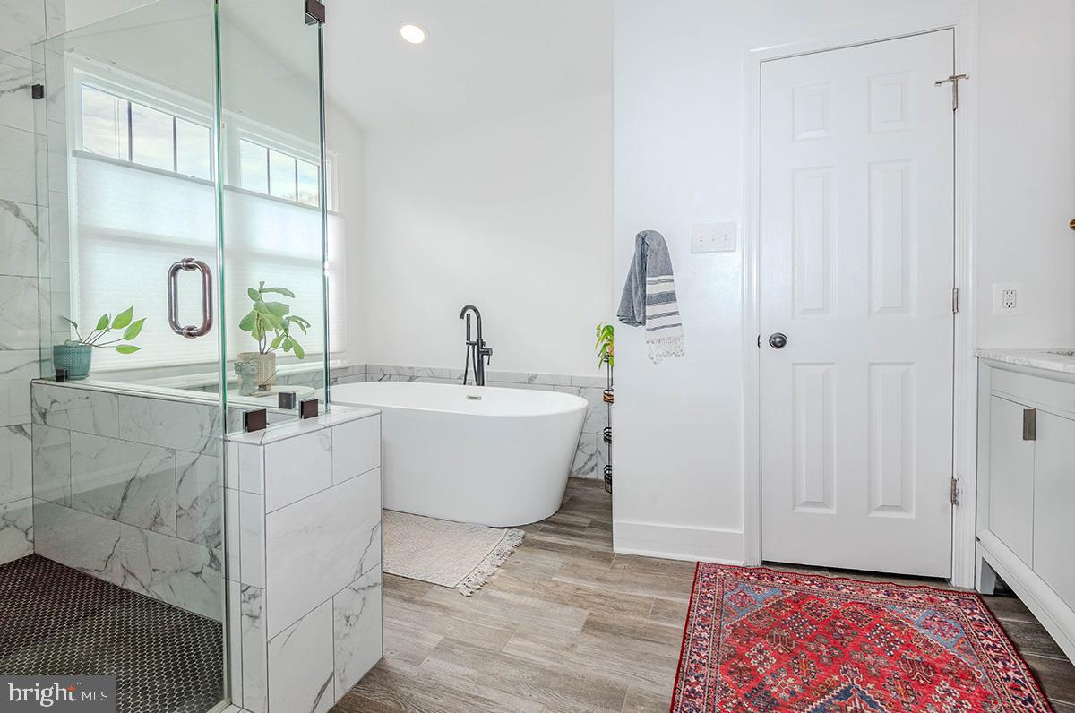 1665 Patrice Circle Crofton, MD 21114 - Photo 25 of 55 a bathroom with a bathtub and a sink