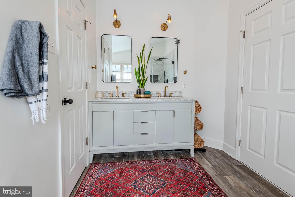 1665 Patrice Circle Crofton, MD 21114 - Photo 27 of 55 a room with a mirror and a sink